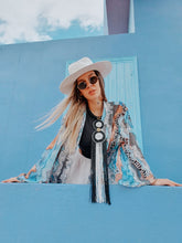 Load image into Gallery viewer, KIMONO with animal print, color blue grey zebra inspired by nature, sustainable fabrics styled with hat and white boots perfect for summer and spring