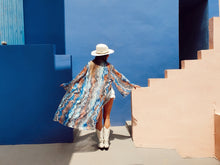 Load image into Gallery viewer, KIMONO with animal print, color blue grey zebra inspired by nature, sustainable fabrics styled with hat and white boots perfect for summer and spring