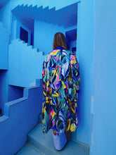 Load image into Gallery viewer, KIMONO WITH FLOWERS AND LEAVES ,COLORFUL PERFECT FOR SUMMER DAYS OR FOR PARTIES, medium lenght shot in Muralla Roja, Spain
